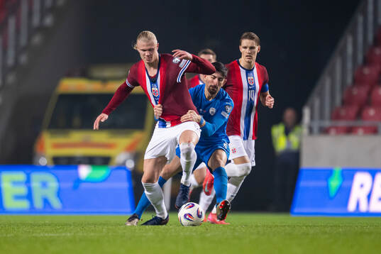Erling Braut Haaland of Norway and Idan Nachmias of Israel