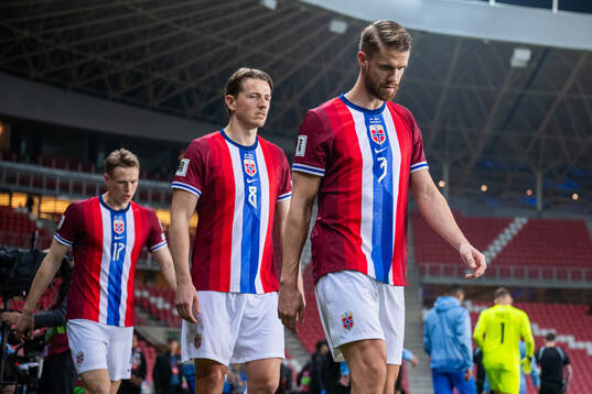 Sander Berge and Kristoffer Ajer of Norway enter the pitch