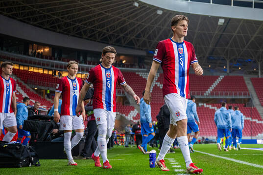 David Møller Wolfe of Norway enters the pitch