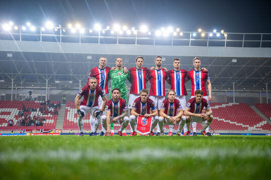 The starting eleven of Norway pose for a team photo