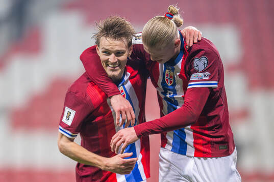 Erling Braut Haaland of Norway celebrates with teammate
