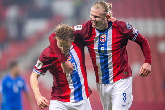 Erling Braut Haaland of Norway celebrates with teammate