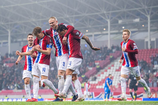 Erling Braut Haaland of Norway celebrates with teammates