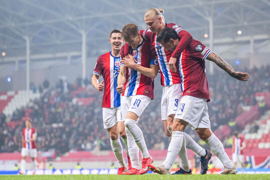 Erling Braut Haaland of Norway celebrates with teammates