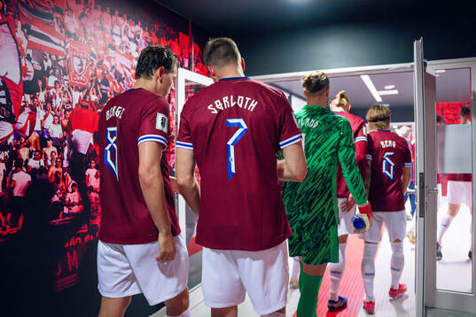 Sander Berge and Alexander Sørloth of Norway at half-time