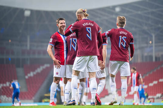 Erling Braut Haaland of Norway celebrates with teammate