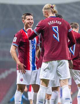Erling Braut Haaland of Norway celebrates with teammate