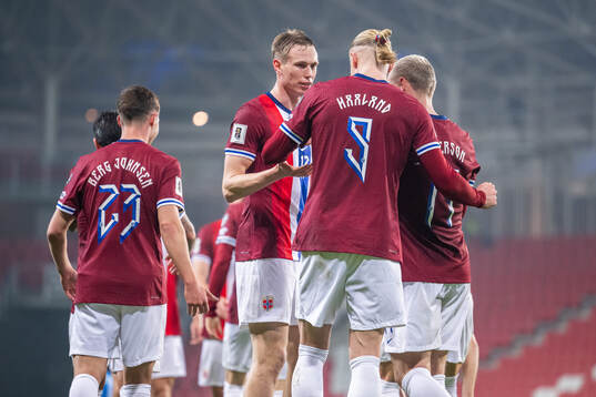 Erling Braut Haaland of Norway celebrates with teammate