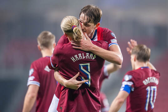 Erling Braut Haaland of Norway celebrates with teammate