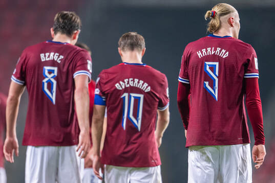 Erling Braut Haaland of Norway with teammates Sander Berge