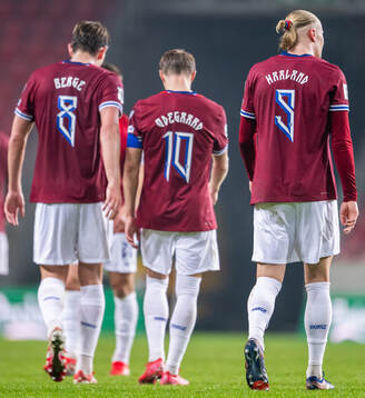 Erling Braut Haaland of Norway with teammates Sander Berge