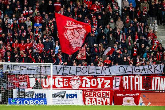 Spectators with a banner