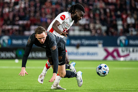 Joachim Soltvedt of Brann and Leonard Owusu of Fredrikstad