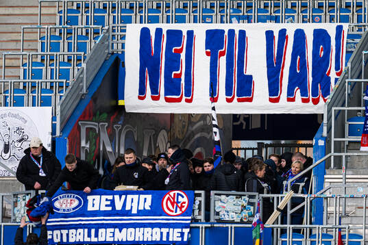 VAR banner and supporters