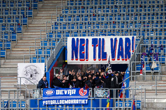 VAR banner and supporters