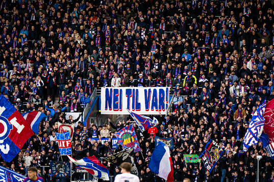 VAR banner and spectators in the stands