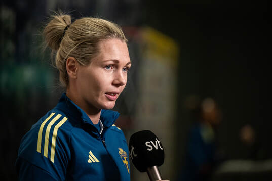 Goalkeeper Jennifer Falk is interviewed
