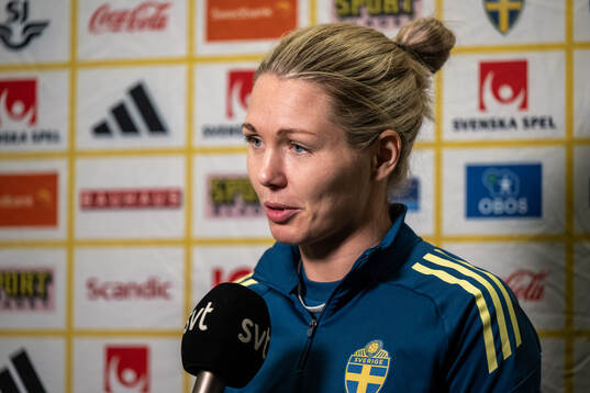 Goalkeeper Jennifer Falk is interviewed