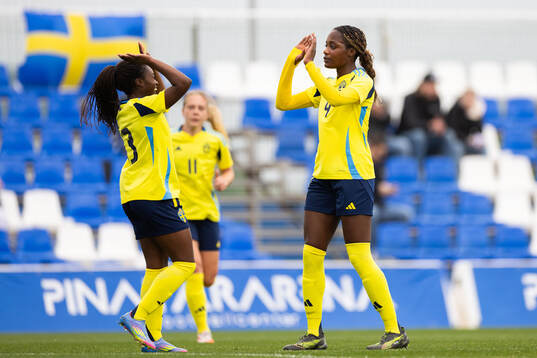 Evelyn Ijeh of Sweden celebrates with Monica Jusu Bah