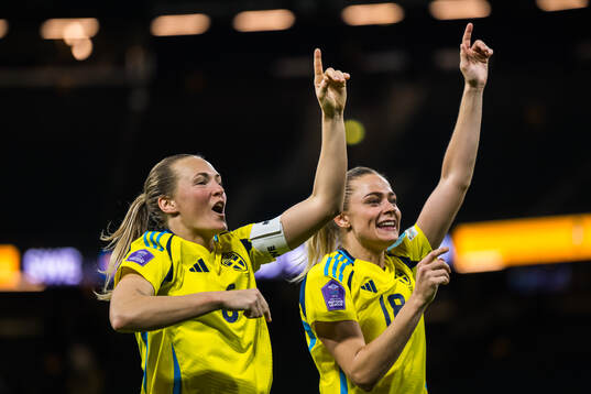Magdalena Eriksson and Fridolina Rolfö of Sweden celebrate