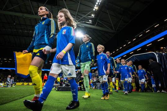 Kosovare Asllani and goalkeeper Jennifer Falk of Sweden