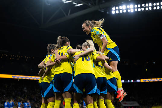 Magdalena Eriksson of Sweden celebrates with team mates and