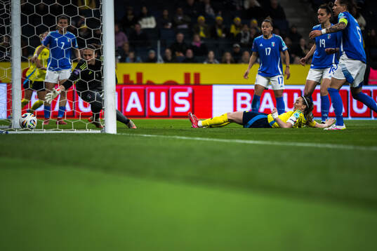 Kosovare Asllani of Sweden scores 1-1 behind goalkeeper