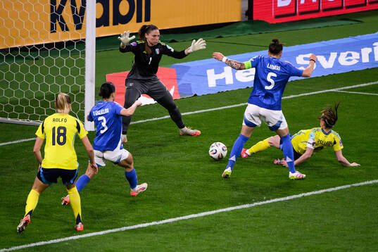 Kosovare Asllani of Sweden scores 1-1 behind goalkeeper