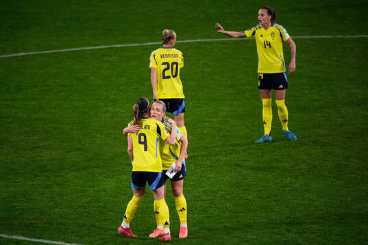 Kosovare Asllani and Magdalena Eriksson of Sweden