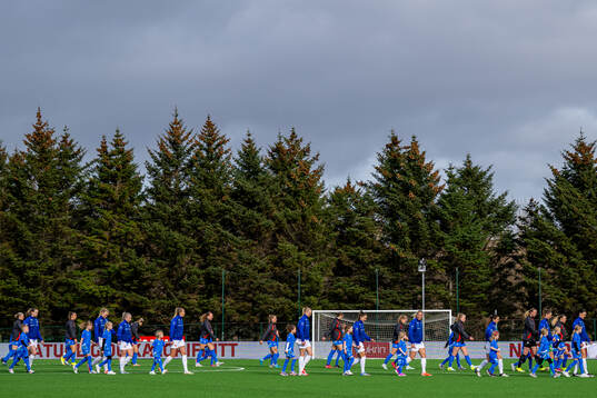 Players of Iceland and Norway enter the pitch