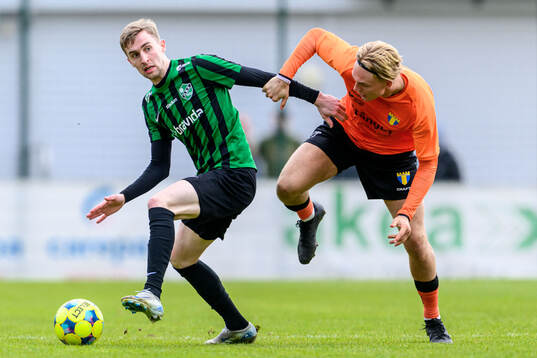 Högaborgs Dennis Ericson och Torns Tom Wassholm