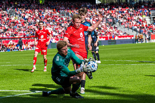 Jakob Let Haugaard of Tromsø and Aune Heggebø of Brann