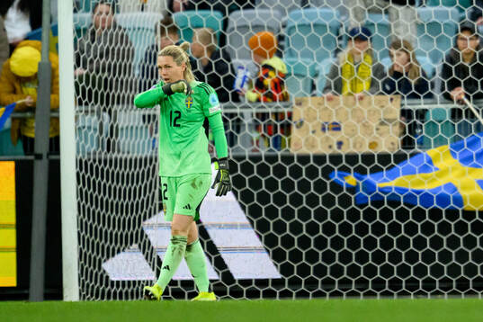 Goalkeeper Jennifer Falk of Sweden looks dejected