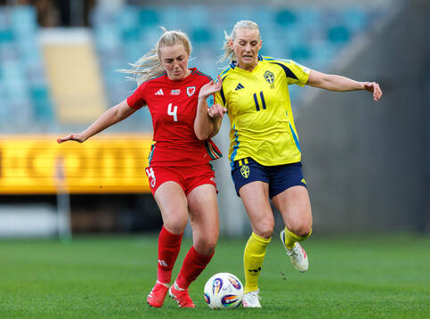 Mayzee Davies of Wales and Stina Blackstenius of Sweden