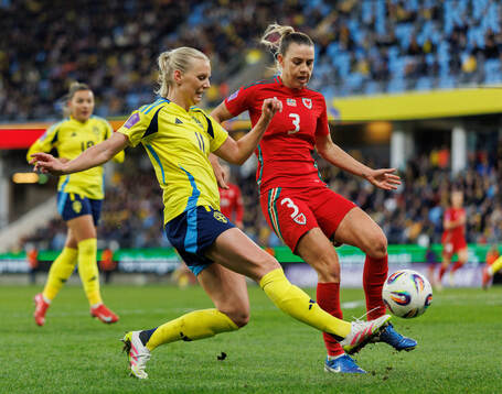Stina Blackstenius of Sweden  and Gemma Evans of Wales