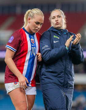 Cathinka Tandberg and goalkeeper Aurora Mikalsen of Norway