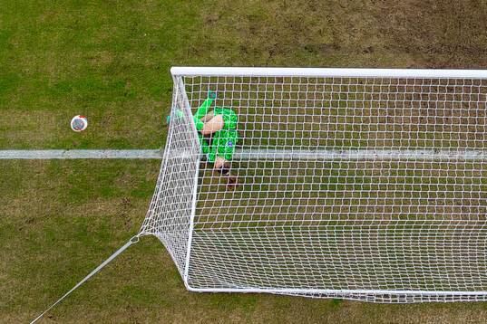 Goalkeeper Cecilie Fiskerstrand of Norway crashes into the