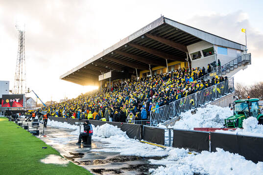 Spectators in the stands at Aspmyra Stadion