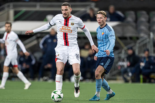 Ercan Kara of Rapid Wien and Tobias Gulliksen of Djurgården
