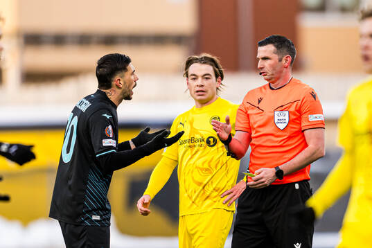 Mattia Zaccagni of Lazio and Michael Oliver, referee