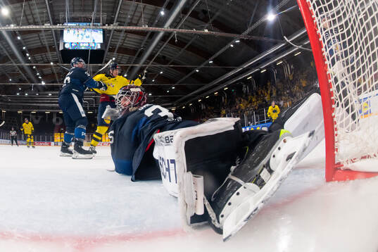 Goaltender Oskari Salminen and Mikael Seppälä of Finland