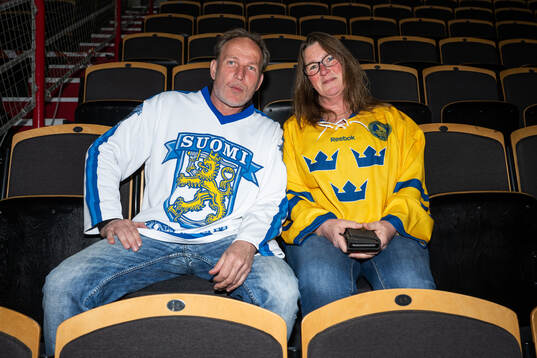 Spectators pose for a photo