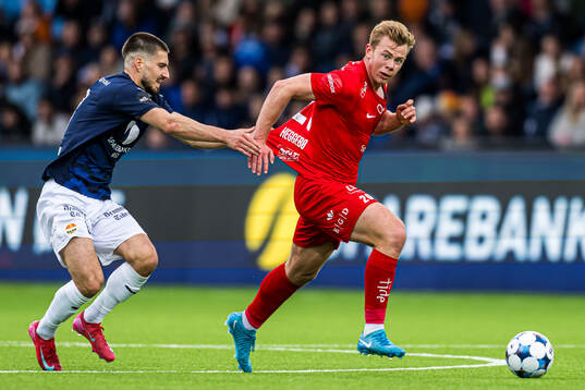 Kreshnik Krasniqi of Strømsgodset and Aune Heggebø of