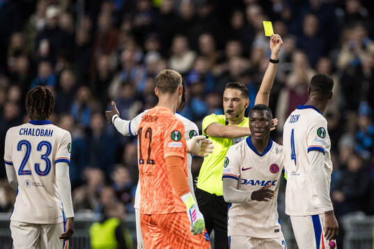 Tosin Adarabioyo of Chelsea receives a yellow card