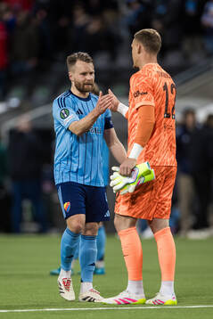Jacob Une of Djurgården and goalkeeper Filip Jørgensen of