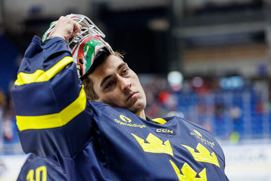 Goaltender Arvid Holm of Sweden