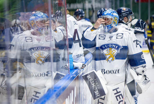 Juuse Saros of Finland looks dejected