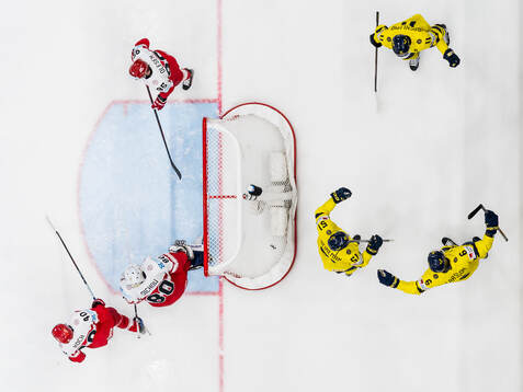 Adam Larsson, Emil Heineman and Mikael Backlund of Sweden