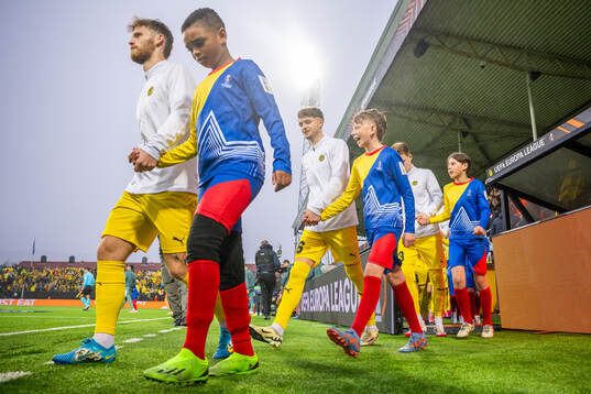 Ole Didrik Blomberg and Håkon Evjen of Bodø/Glimt enter