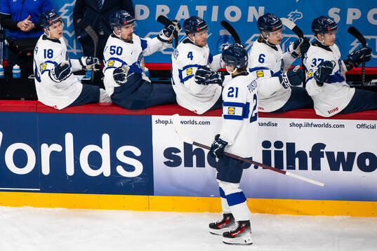 Patrik Puistola of Finland celebrates with team mates